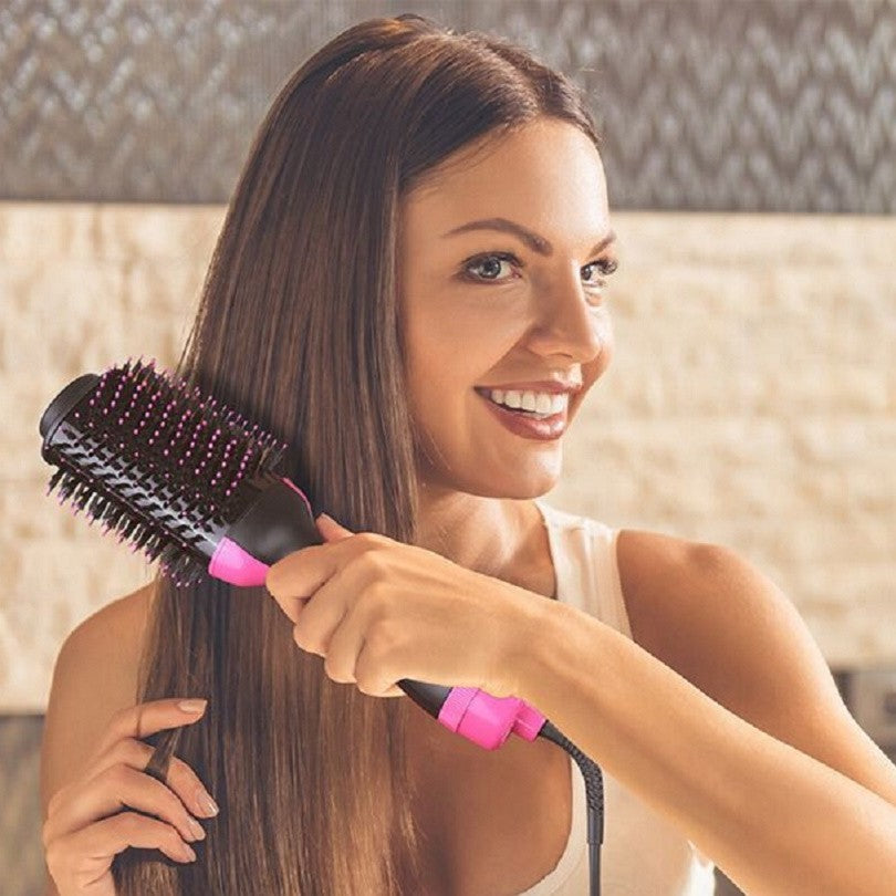 Woman smoothing long straight hair with the GlideCool Bloumé Lift